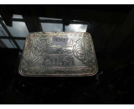 A white metal tobacco or cigarette box of hinged rectangular form, inscribed 'R. A. Miri' and dated 1923 