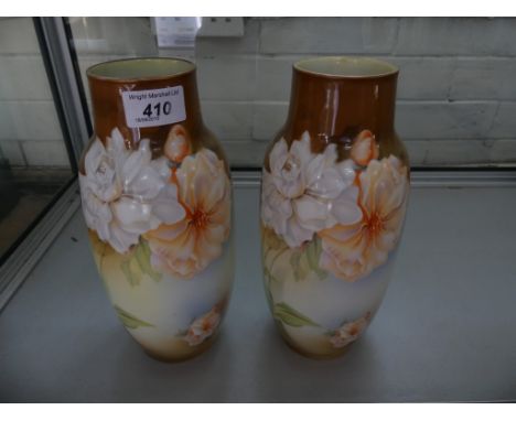 A pair of early 20th Century German vases by R. S. Suhl, decorated with floral detail 