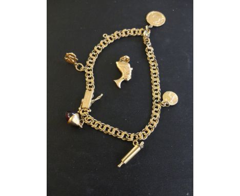 An 18ct gold charm bracelet, the fancy link chain suspending fine charms to include a rolling pin and a Taurus charm, with on