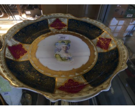 A large Vienna frilled circular dish decorated with a central portrait of a lady, bearing signature Le Brun 