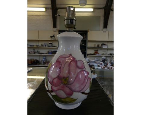 A Moorcroft table lamp of bulbous form, decorated in the Magnolia pattern (sold electrically untested) 