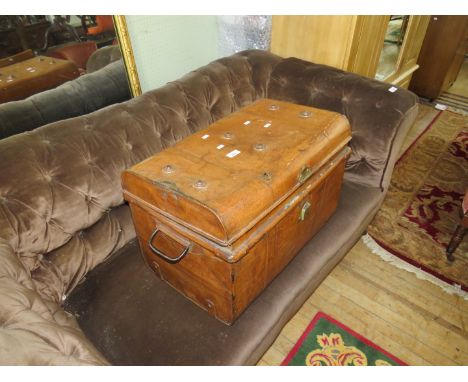 A metal trunk containing dolls and teddy bears 