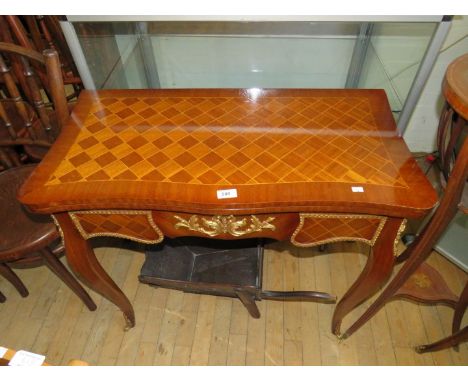 A reproduction French style card table, with mahogany frame and green baize interior and ormolu mounts 