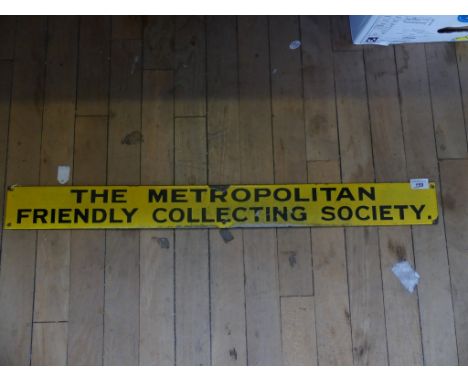 A vintage enamel sign marked 'The Metropolitan Friendly Collecting Society' 