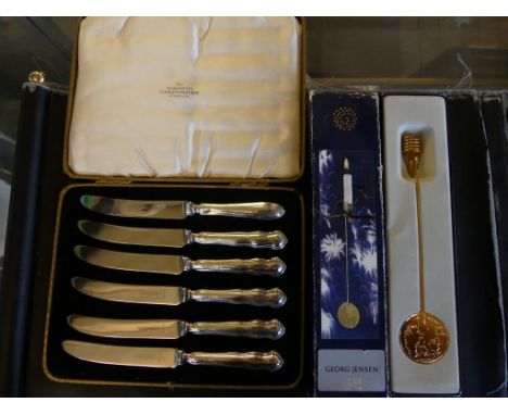A mixed lot comprising six silver handled butter knives, bearing Sheffield hallmarks together with a Georg Jensen Millenium l