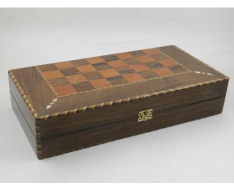 A mother-of-pearl and parquetry inlaid walnut chess board, containing backgammon board and pieces. W.40cm