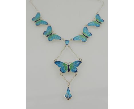 A silver and enamel butterfly pendant, in the Art Nouveau taste. 