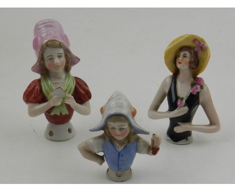 Three early 20th century ceramic pin cushion dolls (lacking cushions). 