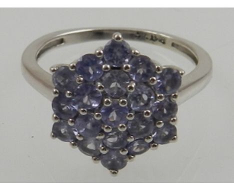 A 9 carat white gold and lavender tanzanite cluster ring. 