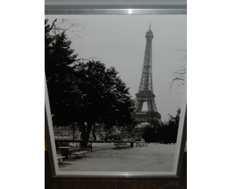 A monochrome photographic print, The Eiffel Tower in Winter. H.59cm W.49cm