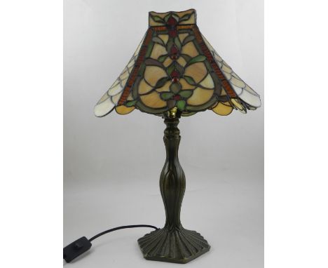 A table lamp, in the style of Tiffany, having glass shade. H: 45cm