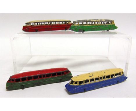 FOUR PRE-WAR DINKY NO.26, G.W.R. RAIL CARS the first with a lead body, red over green, green plastic roller wheels, fair cond