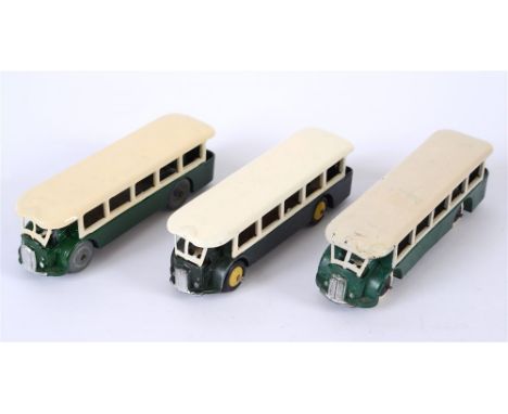 THREE FRENCH DINKY NO.29D, RENAULT TN4H PARIS BUSES the first cream over green, with a black baseplate, smooth black hubs and