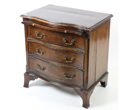 A Georgian style serpentine fronted Chest, of three drawers with brush and slide, on bracket feet, together with an Edwardian