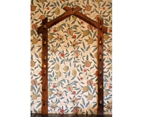 A collection of 4 varied Edwardian oak Stick and Hat Racks, with brass hooks. (4)