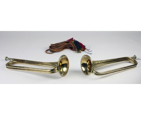 A pair of large copper and brass Bugle Horns, by Henry Keat &amp; Sons, London, dated 1916, with tassels. (2)