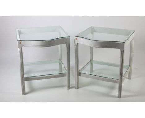 A pair of painted wooden bow fronted glass topped two shelf Bedside Tables, together with a circular painted Table. (3)