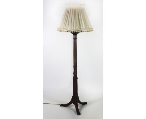 A pair of mahogany Jardinieres, with reeded column on tripod outsplayed legs with brass lion paw castors, converted as lamps.