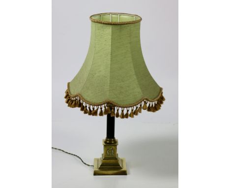 A Corinthian column decorated brass Table Lamp, with ebonised reeded pillar and with green shade. (1)