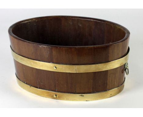 A large circular late 19th Century brass bound oak Tub, for shrubs, by Alexander Hamilton of London, 46cms (18") diameter; an