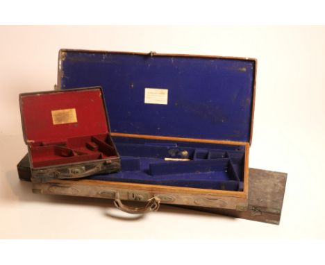 A good brass bound leather Gun-Case for a pair of shotguns, labelled 'H. Trulock Harris, London,' inscribed "J. Alexander, Mi