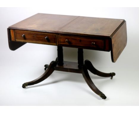 A 19th Century mahogany Sofa Table, in the manner of Duncan Phyfe, the top with large crossbanded border, with drop sides and