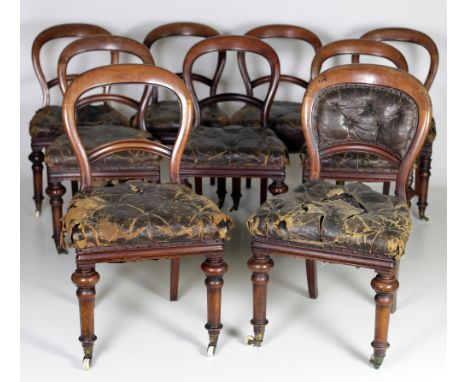 A set of 18 Irish Victorian mahogany balloon back Dining Chairs, by Jones &amp; Co. Dublin, the open backs over hide covered 