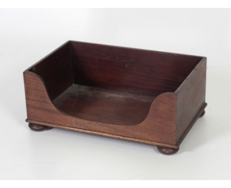 A 19th Century mahogany Book Trough, on bun feet, together with a Table Bookstand with carved ends. (2)