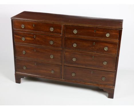 An unusual Georgian period Irish mahogany double Chest, with eight short drawers, circular decorated brass drop handles on br