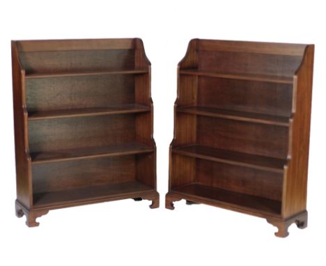 An attractive pair of Georgian style mahogany waterfall four shelf Bookcases, on bracket feet, approx. 122cms x 97cms (48" x 