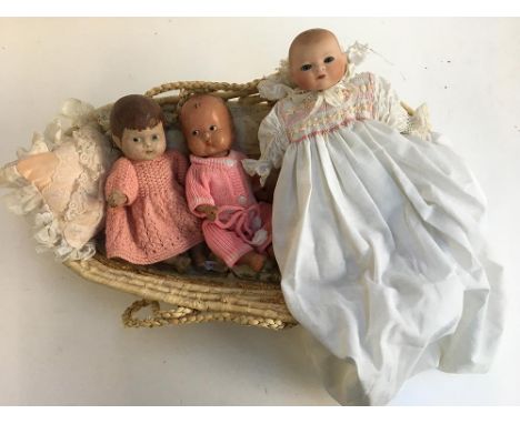 A small 20th century doll with ceramic head, marked 'Rachel Karslake 1985'; together with two other vintage dolls 