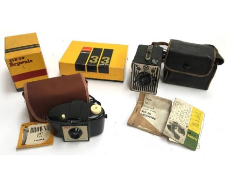 A Kodak Brownie 127 camera in case with instructions; a Kodak six-20 brownie in carry case with instructions; a Kodak six-20 