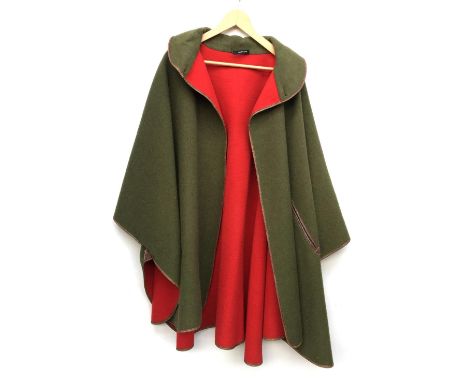 A Gurflix green and red lowland cloak with leather trim; together with a navy wool hooded cape; and a size 42 sheepskin jacke