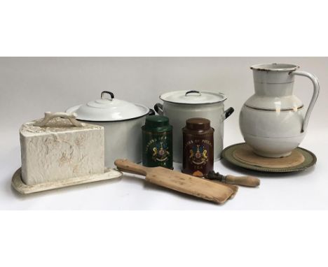 A mixed lot of vintage kitchenalia, to include several enamel bread bins, enamel jug, butter pats, bread board, cheese cloche