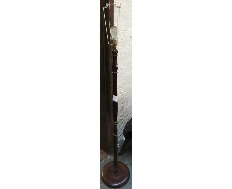 A turned wood standard lamp 