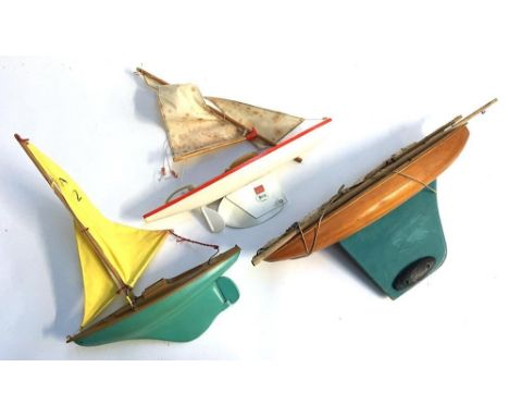 Three vintage pond yachts, the first made in Spain, made by Jugeuetes Oginero, retailed by Harrods; a second later one; the t