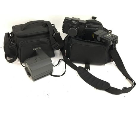 A Polaroid OneStep closeup camera, working, in Optex soft case; together with a Holga 120N and a Luxon Phototechnics 9800A fl