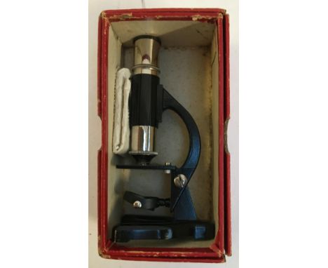 A vintage children's microscope, with two slides, in original box 