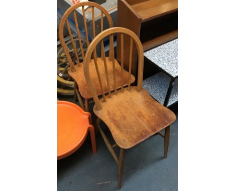 A pair of Ercol style stick back beechwood kitchen chairs 