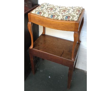 An oak piano stool with drop in top on cabriole legs, together with a mahogany baby bath stool 