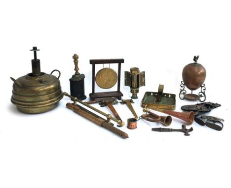 A mixed lot of copper and brass items to include: horse brasses; stirrups; square brass candle holder; brass adjustable candl