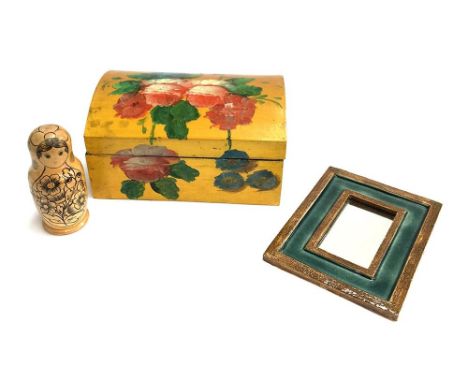 A hinged wooden box with hand painted floral design; together with a Russian doll and a small mirror in ceramic frame 