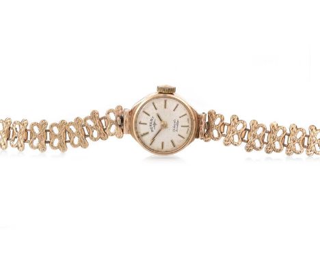 ROTARY NINE CARAT GOLD MANUAL WIND WRIST WATCH the round dial with baton hour markers, 17mm case, on a nine carat gold bracel