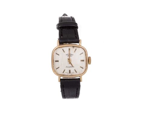 ROTARY NINE CARAT GOLD MANUAL WIND WRIST WATCH the cushion dial with baton hour markers, 22mm case, on a black leather strap,