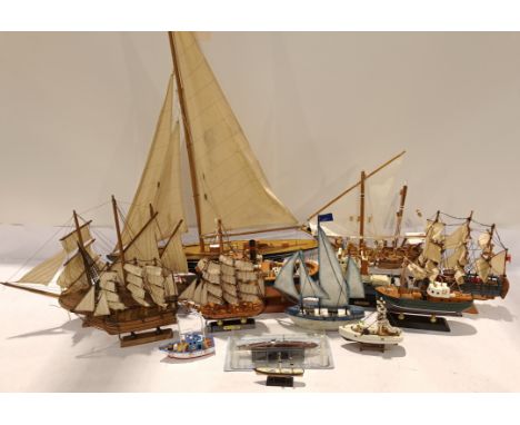 A Mixed unboxed Group of Wooden Ship Models. Includes ships of various scales possibly includes HMS Mayflower, HMS Bounty wit
