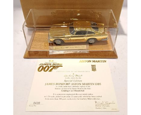 The Danbury Mint, a boxed James Bond 007 1:24 Scale Aston Martin DB5 (Gold). Although unchecked for completeness condition ap