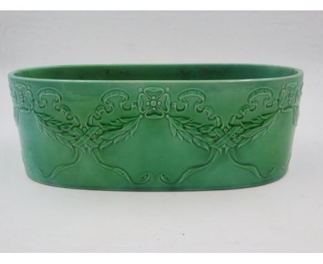 Mintons early 20th century planter decorated with garlands and ribbons in a mottled green glaze L: 27cm. Not available for in
