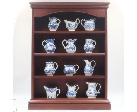 Royal Worcester blue and white Heirloom jug collection with hardwood display cabinet and certificates (12 jugs). Not availabl