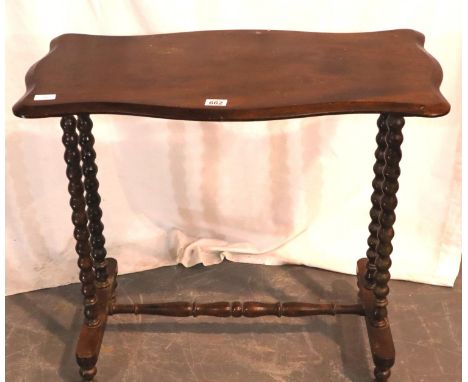 Mahogany shaped table on bobbin supports and turned stretcher, 82 x 43 x 73H cm. Not available for in-house P&amp;P, contact 