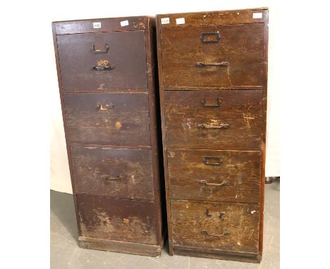 A near pair of 1940s oak and ply four drawer filing cabinets, both solid but in need of light restoration, back board missing